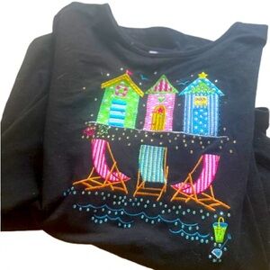 Item number 30 woman’s long sleeve shirt with beach scene